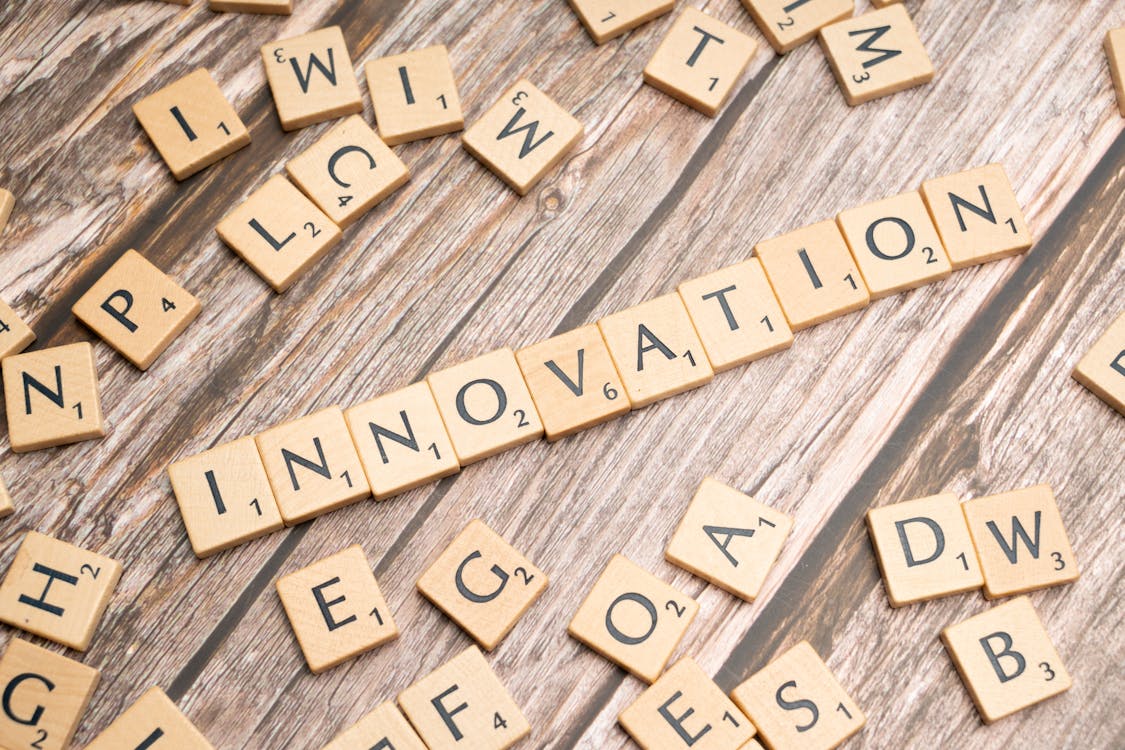 Free The word innovation spelled out in scrabble tiles Stock Photo