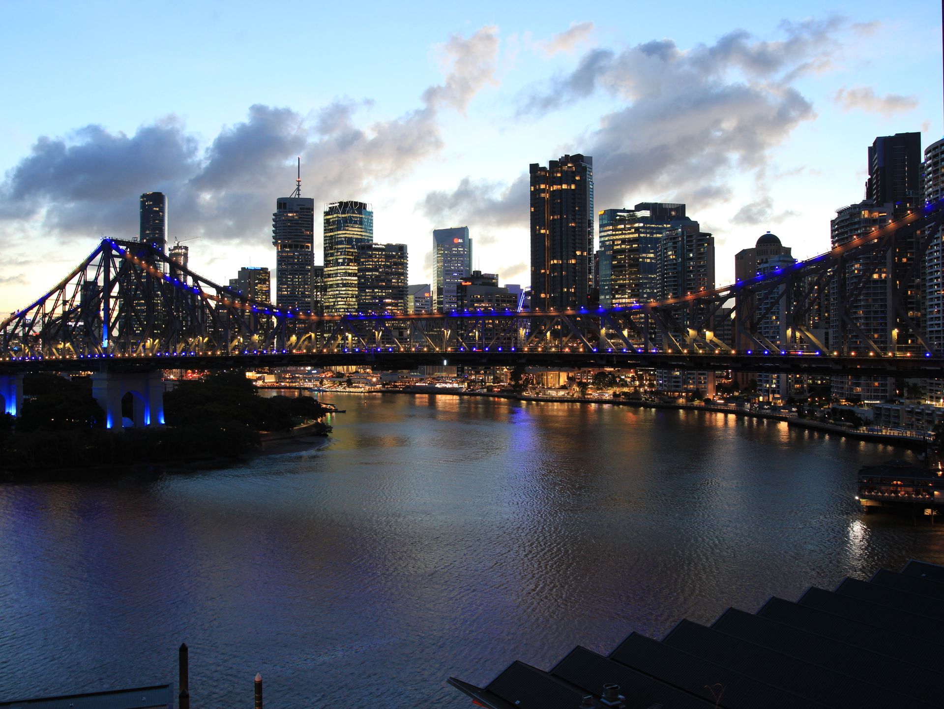 Brisbane skyline with river and bridge in evening light