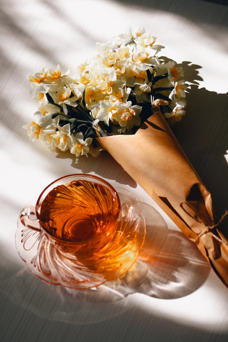 Daffodils And Cup Of Tea