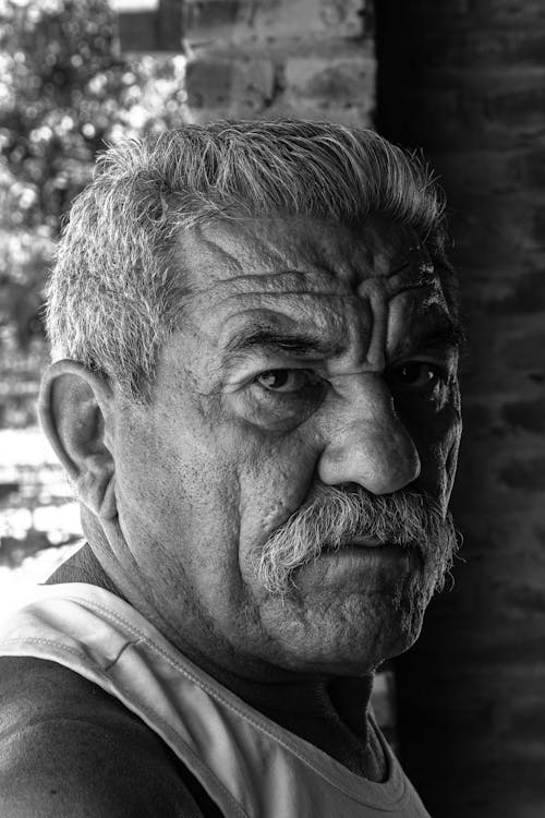 Black and White Portrait of an Elderly Man with Mustache 