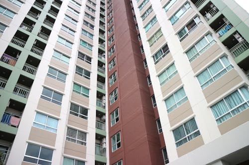 Free Low Angle Shot of an Apartment Block in City  Stock Photo