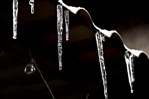 Free Close-up of icicles on a corrugated roof. Winter in Verzé, France. Stock Photo