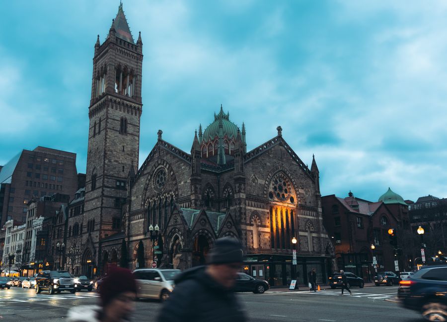 View of the iconic Old South Church with traffic at twilight in Boston, Massachusetts.