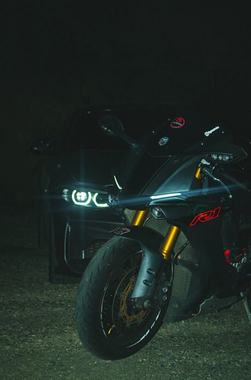 A Car and a Motorcycle at Night 