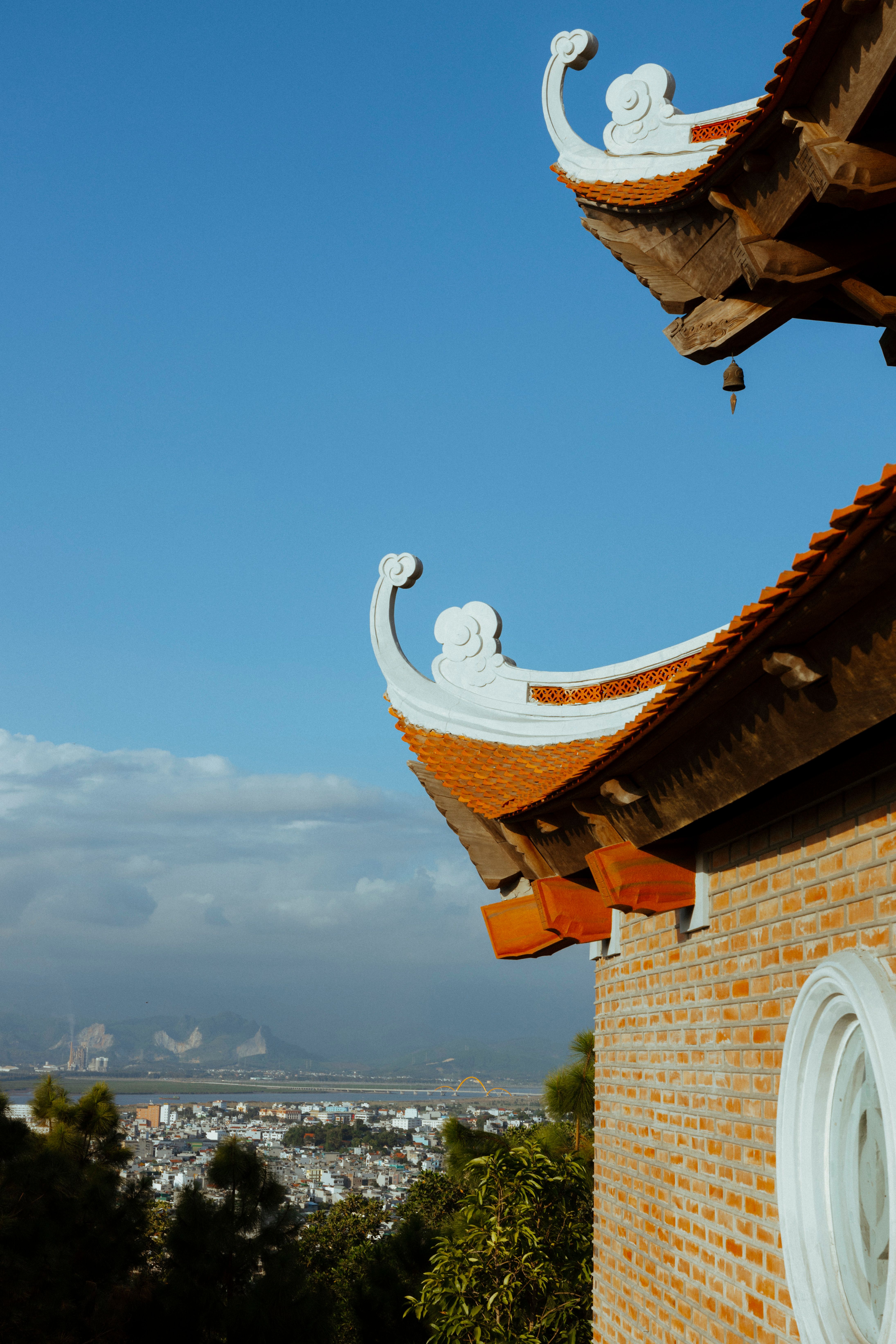 Temple Rooftop with a City in the Background · Free Stock Photo