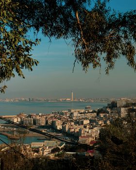 A beautiful aerial view of Algiers cityscape with coastal scenery and lush greenery.
