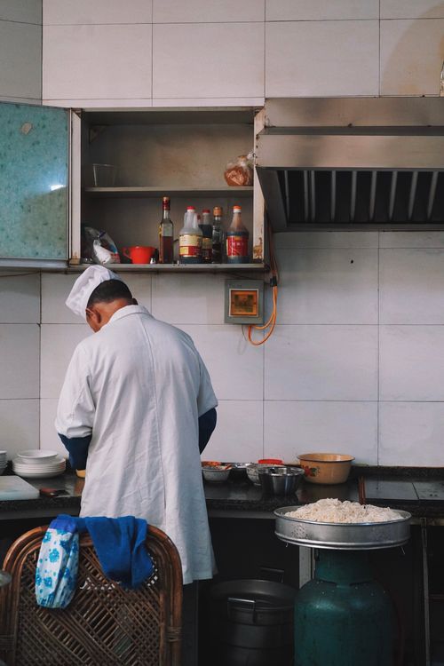 Back View of Cook Working at Kitchen · Free Stock Photo