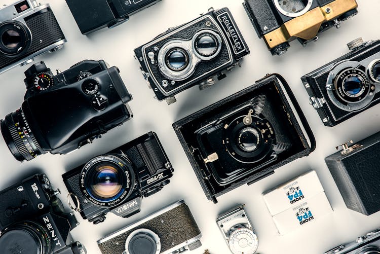 Assorted Black And Gray Cameras