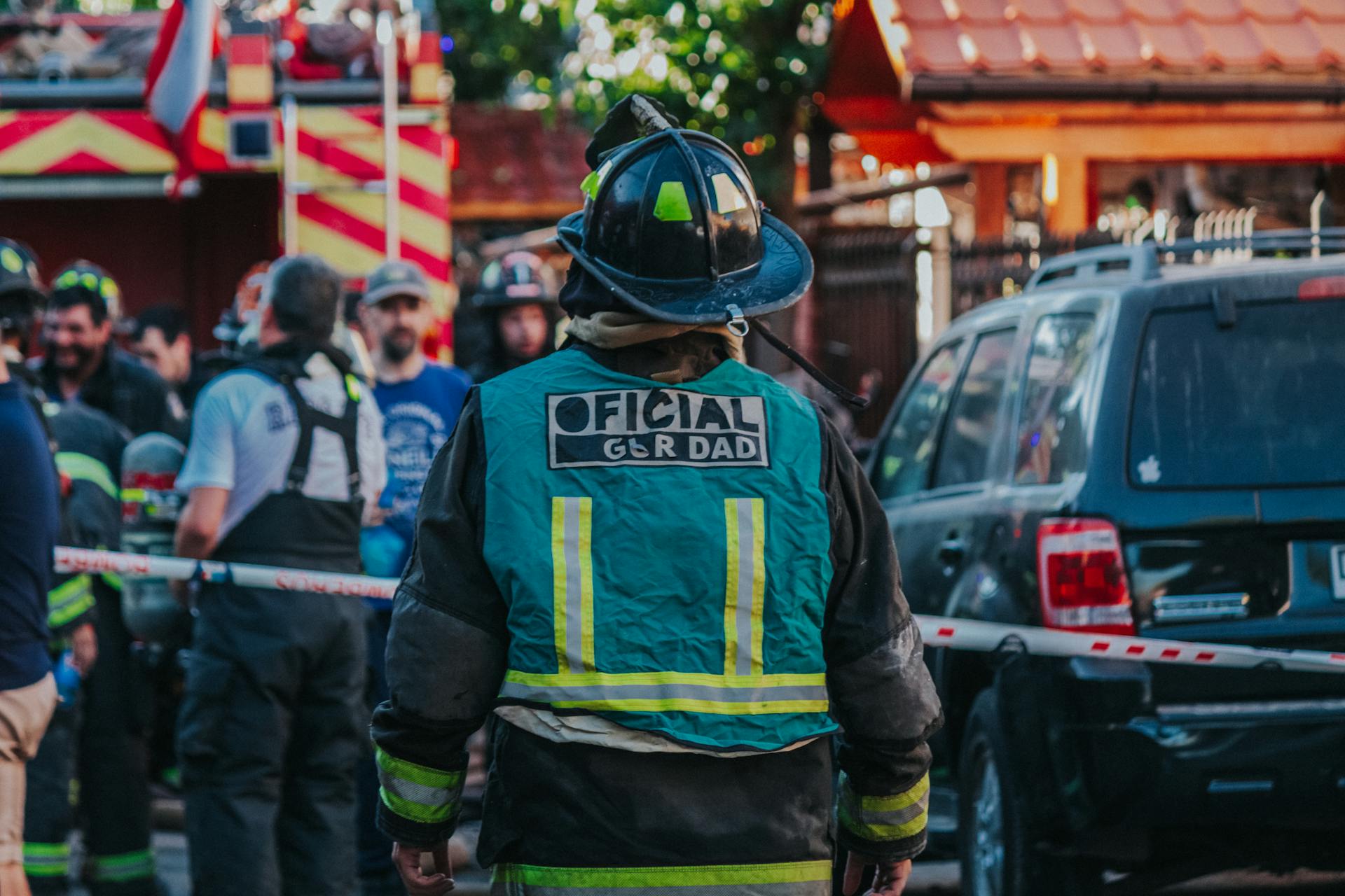 Firefighters in Front of Houses