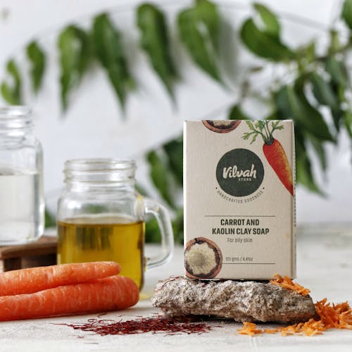 Packaging with Natural Soap and Ingredients on Table