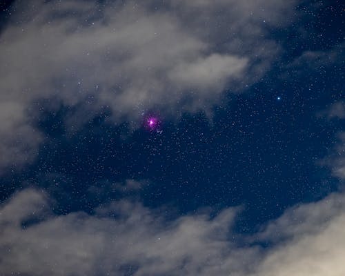 Violet Star Shining in a Cloudy Sky