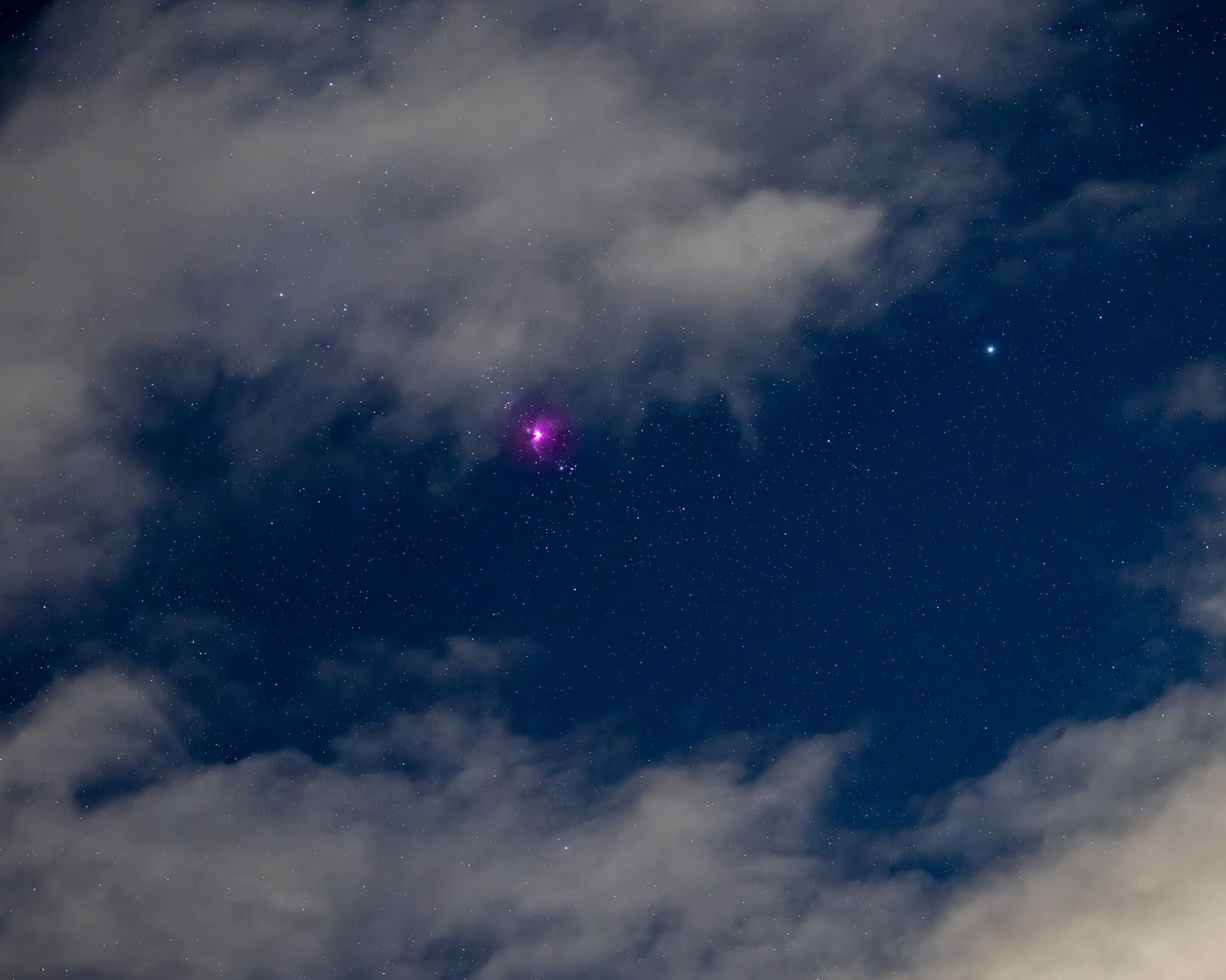 Vibrant night sky with shining stars and visible nebula through clouds in East Wenatchee.