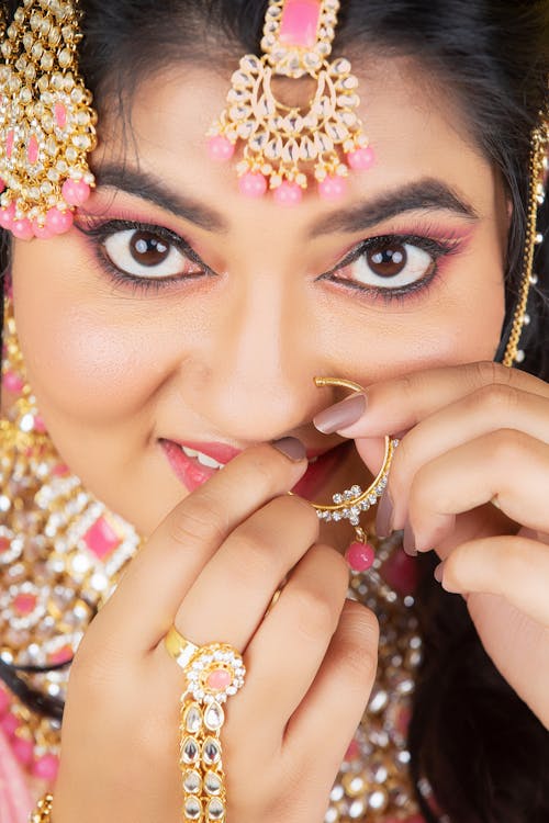 Face of Woman with Golden Piercing and Jewelry