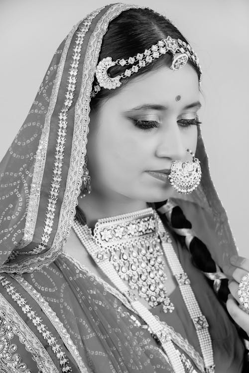 Woman Wearing Traditional Indian Shawl, Saree, and Jewelry