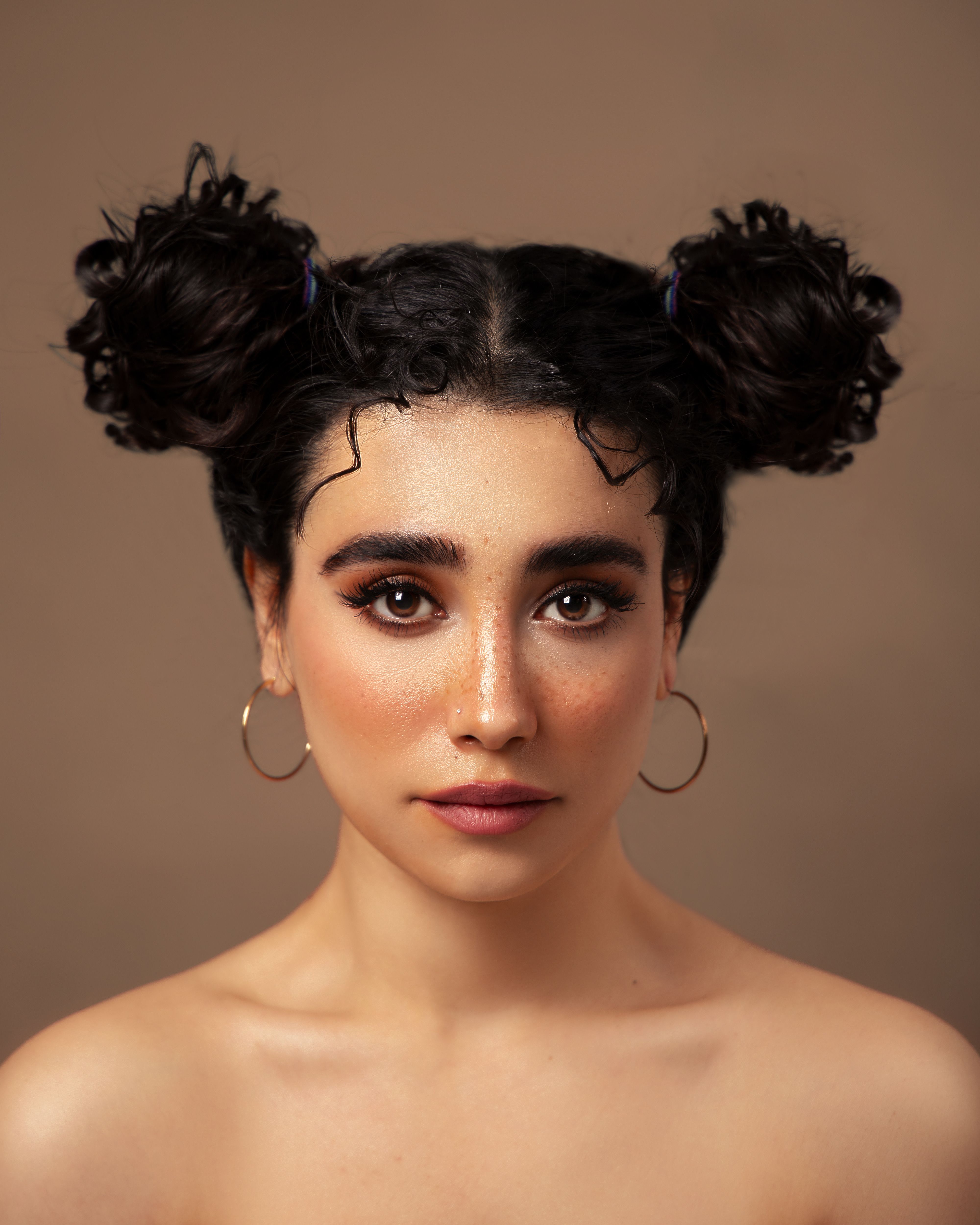 Half-up mini buns on short hair