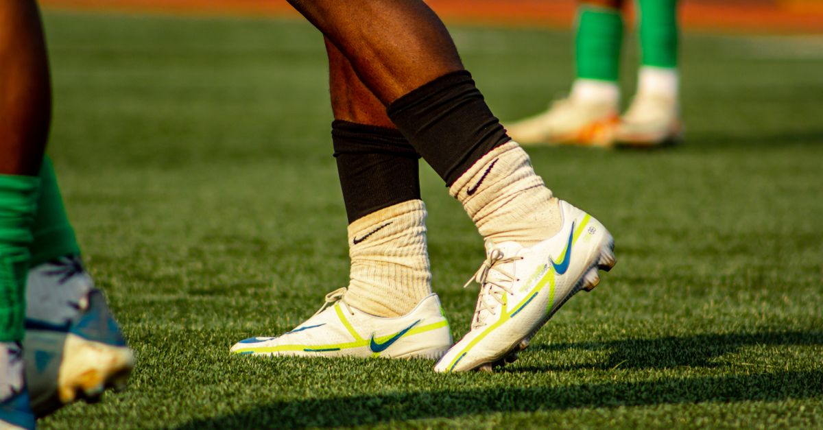 AI technology tracking player movements on soccer field with digital overlays