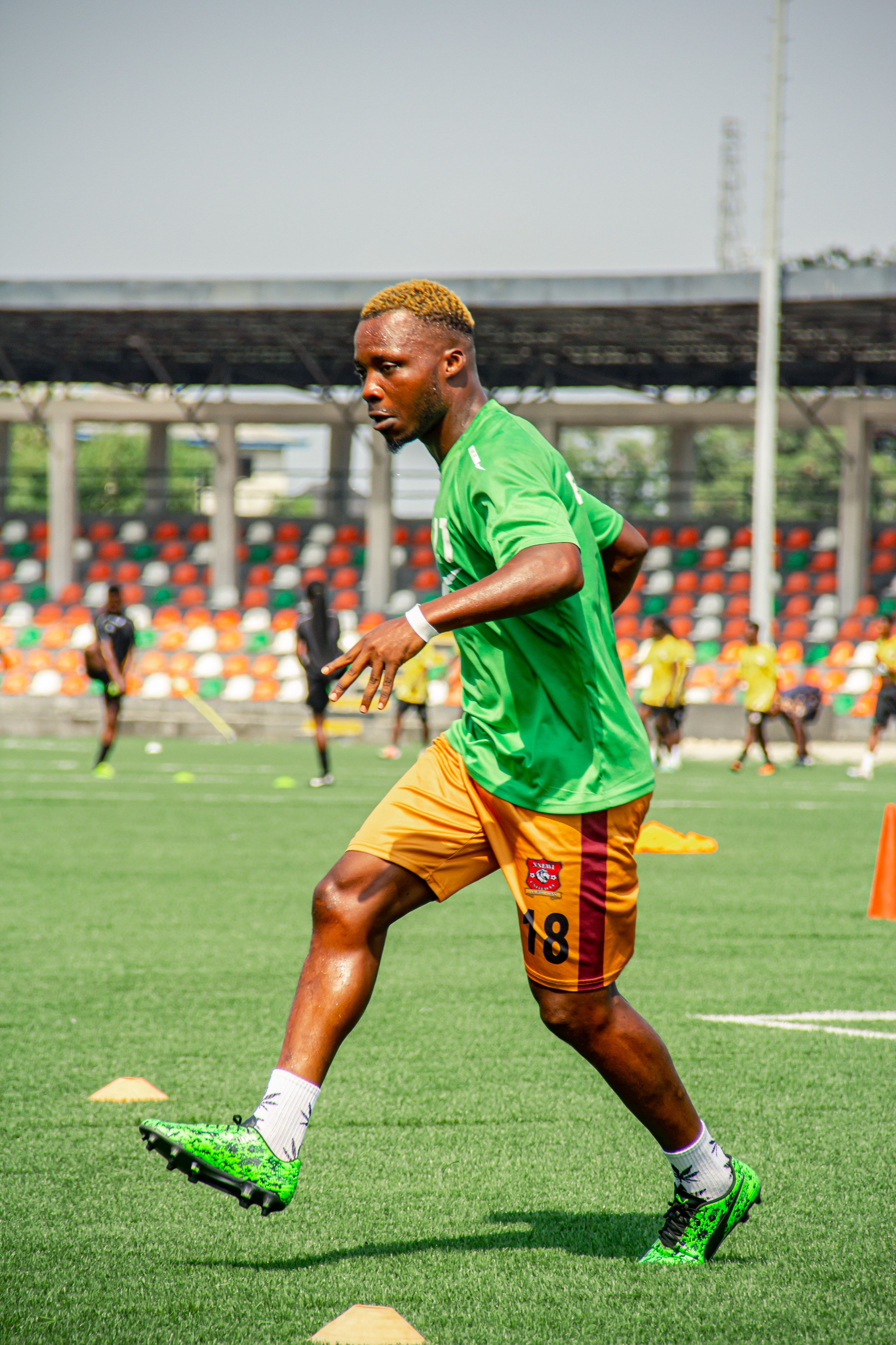 Soccer player in action during field training session. Perfect for sports-focused content.