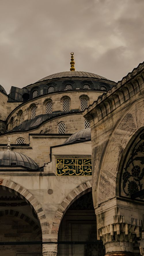 Free Ottoman architectural marvel with intricate domes and arches at dusk. Stock Photo