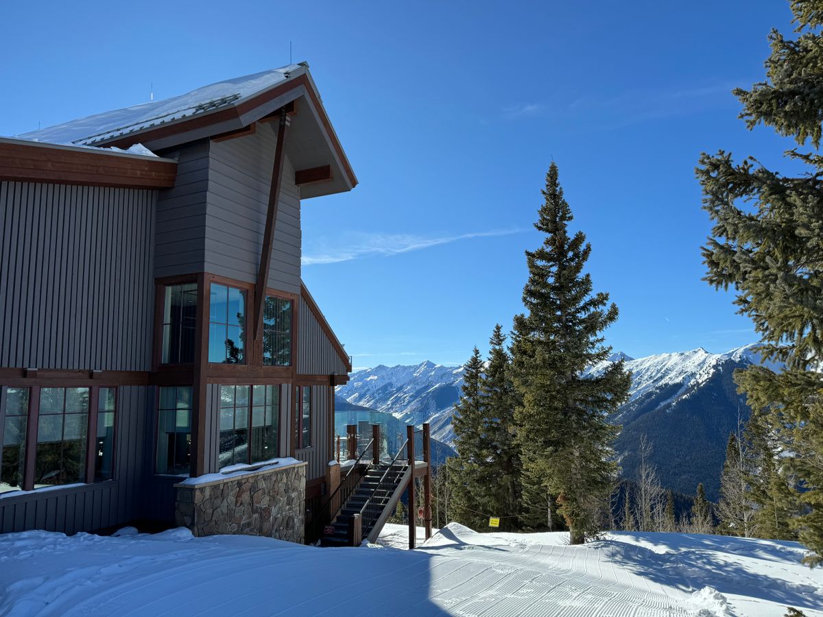 Modern luxury ski lodge in winter mountain setting