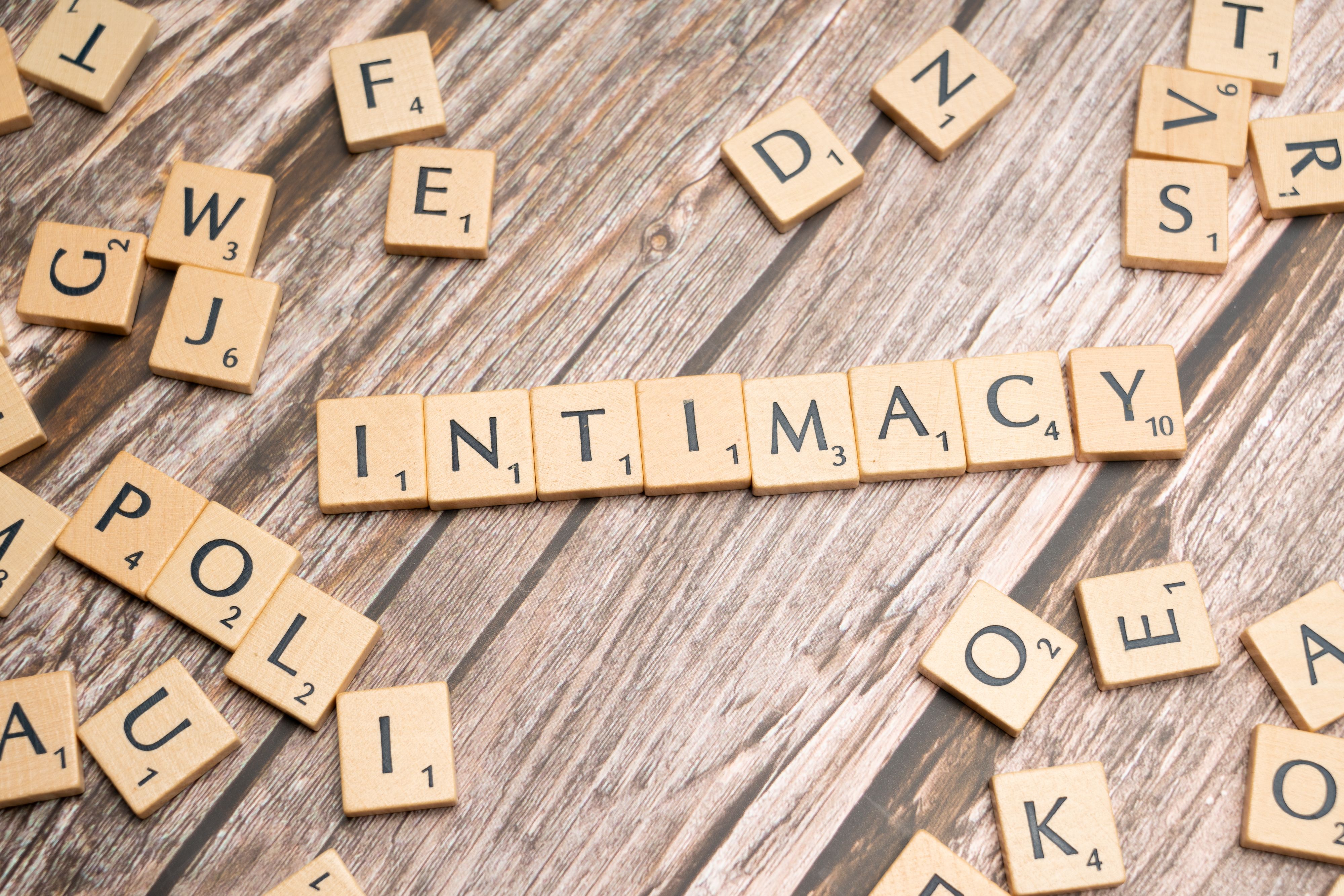 The word intimacy spelled out in scrabble letters · Free Stock Photo