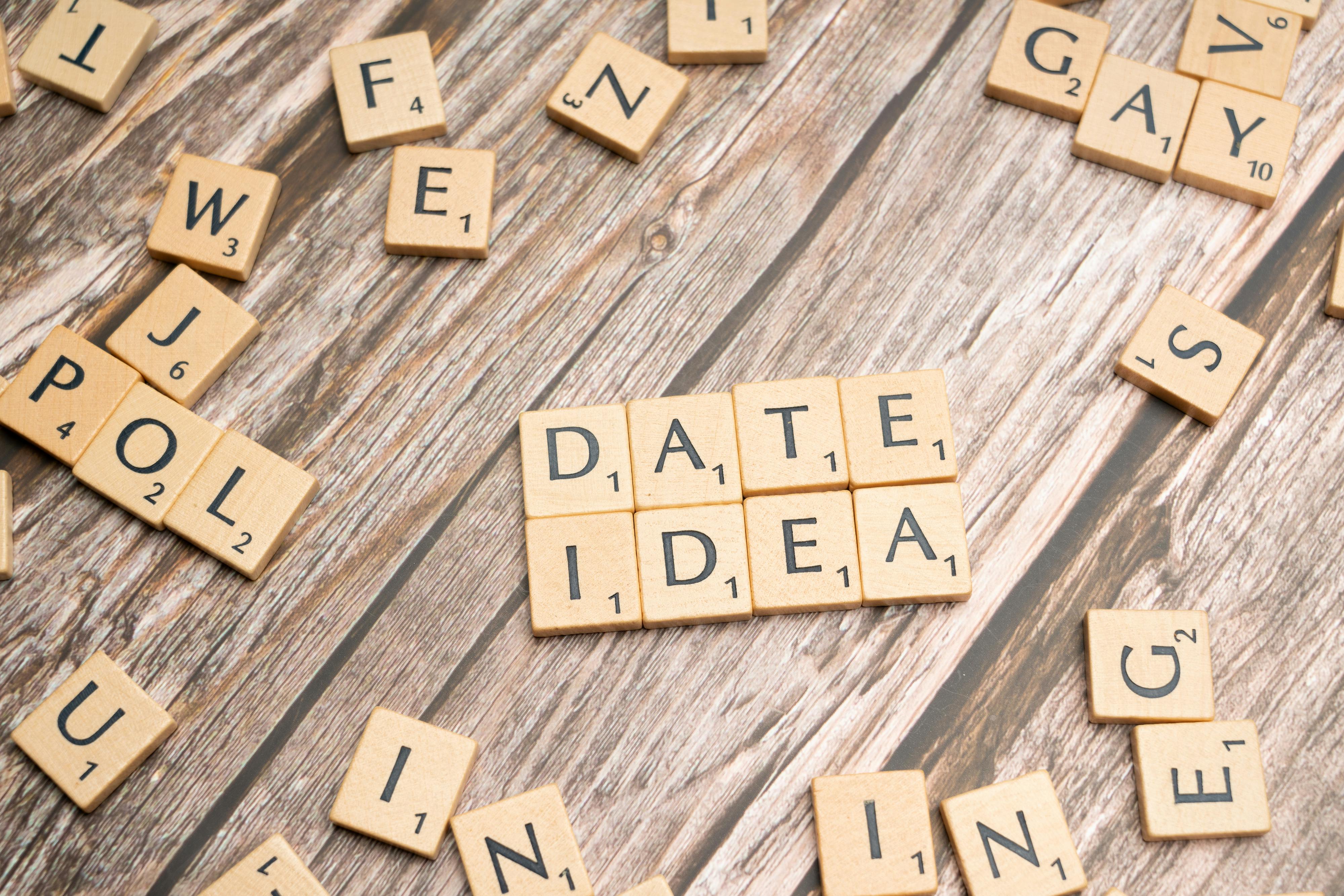 the word date idea spelled out in scrabble tiles