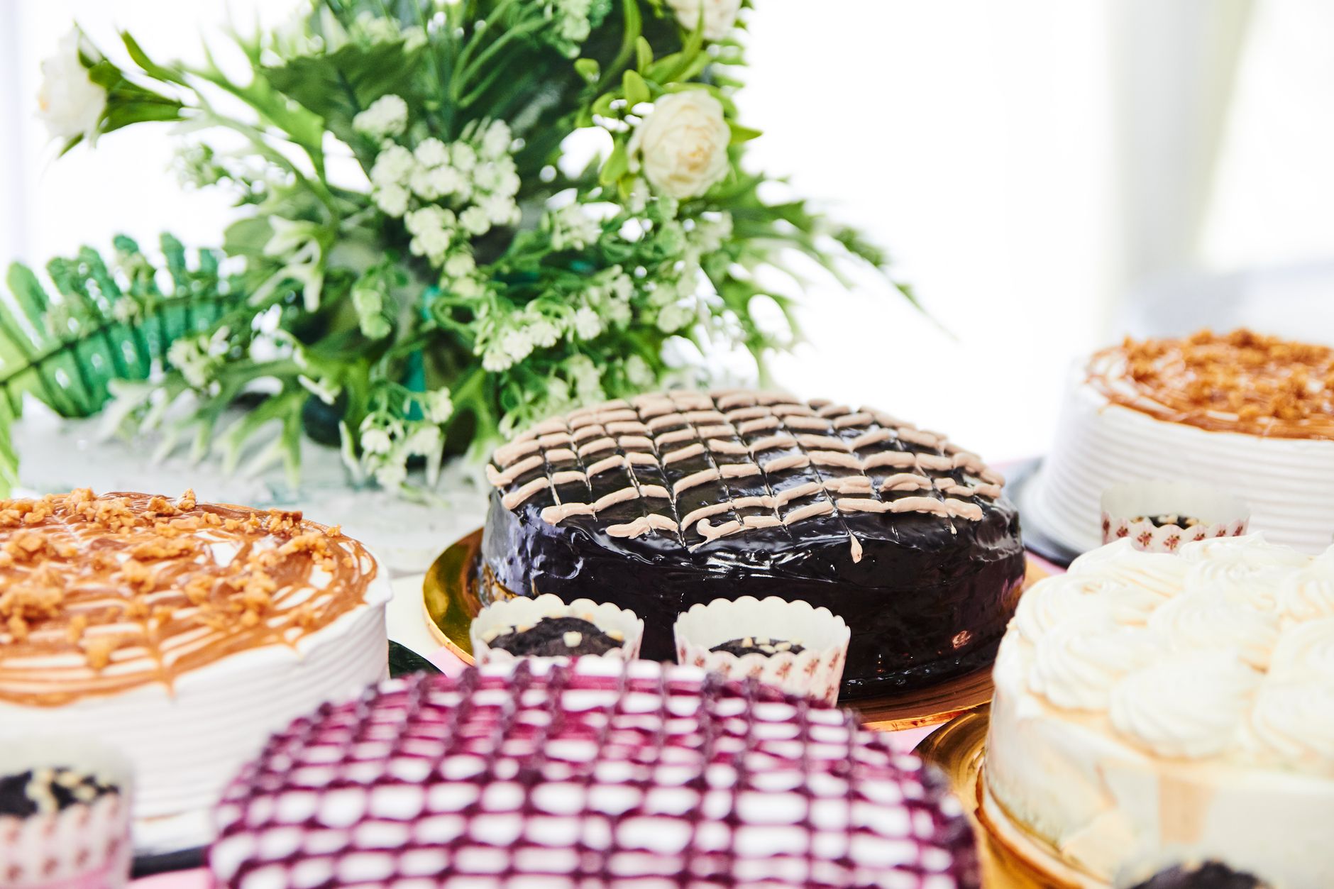 Traditional layered Doberge cake with custard filling and shiny frosting