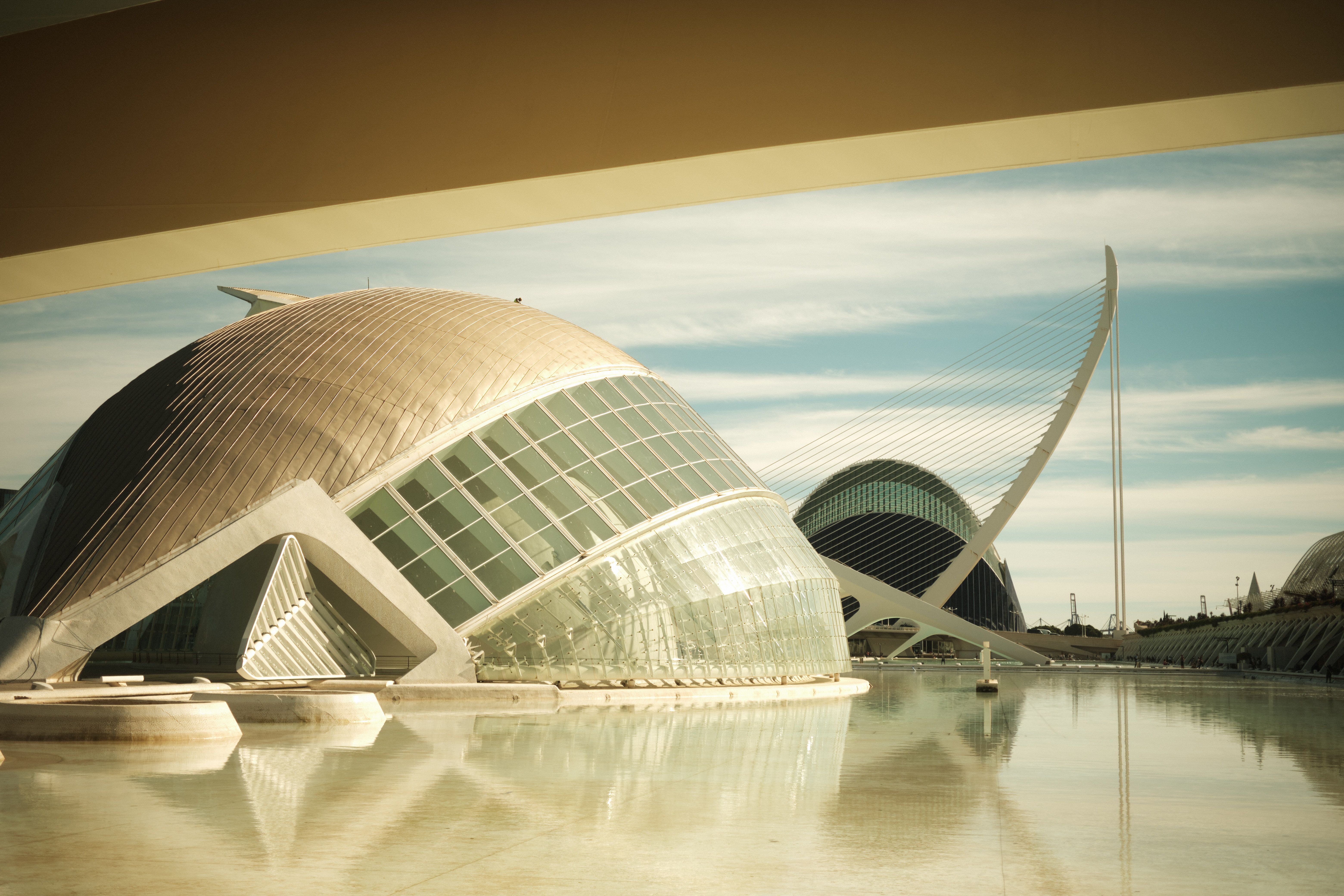 Modern structures reflecting in water at Valencia's City of Arts and Sciences, Spain.