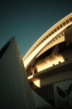 Contemporary architecture showcasing curves and clean lines in Valencia, Spain at sunrise.