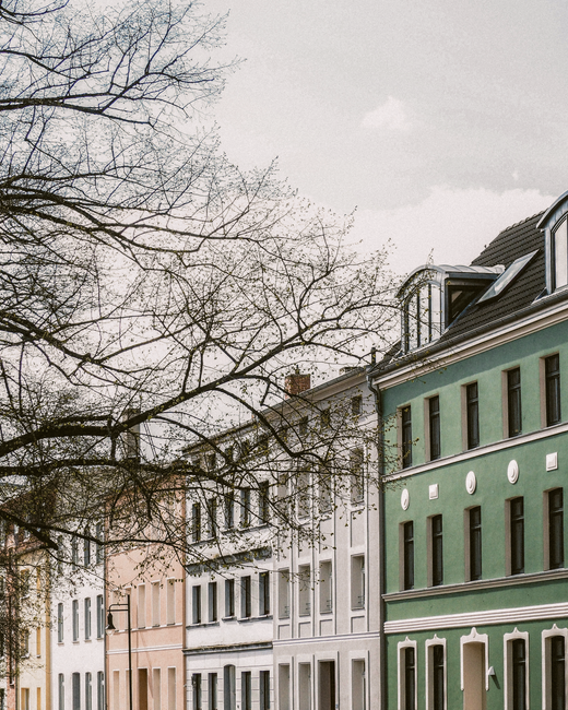 Beautiful urban scene featuring colorful buildings along a tranquil city street.