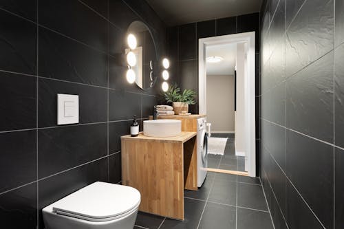 Interior of a Modern Bathroom with Black Tiles 