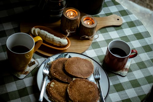 Free Pancakes and Coffee in Mugs for Breakfast Stock Photo