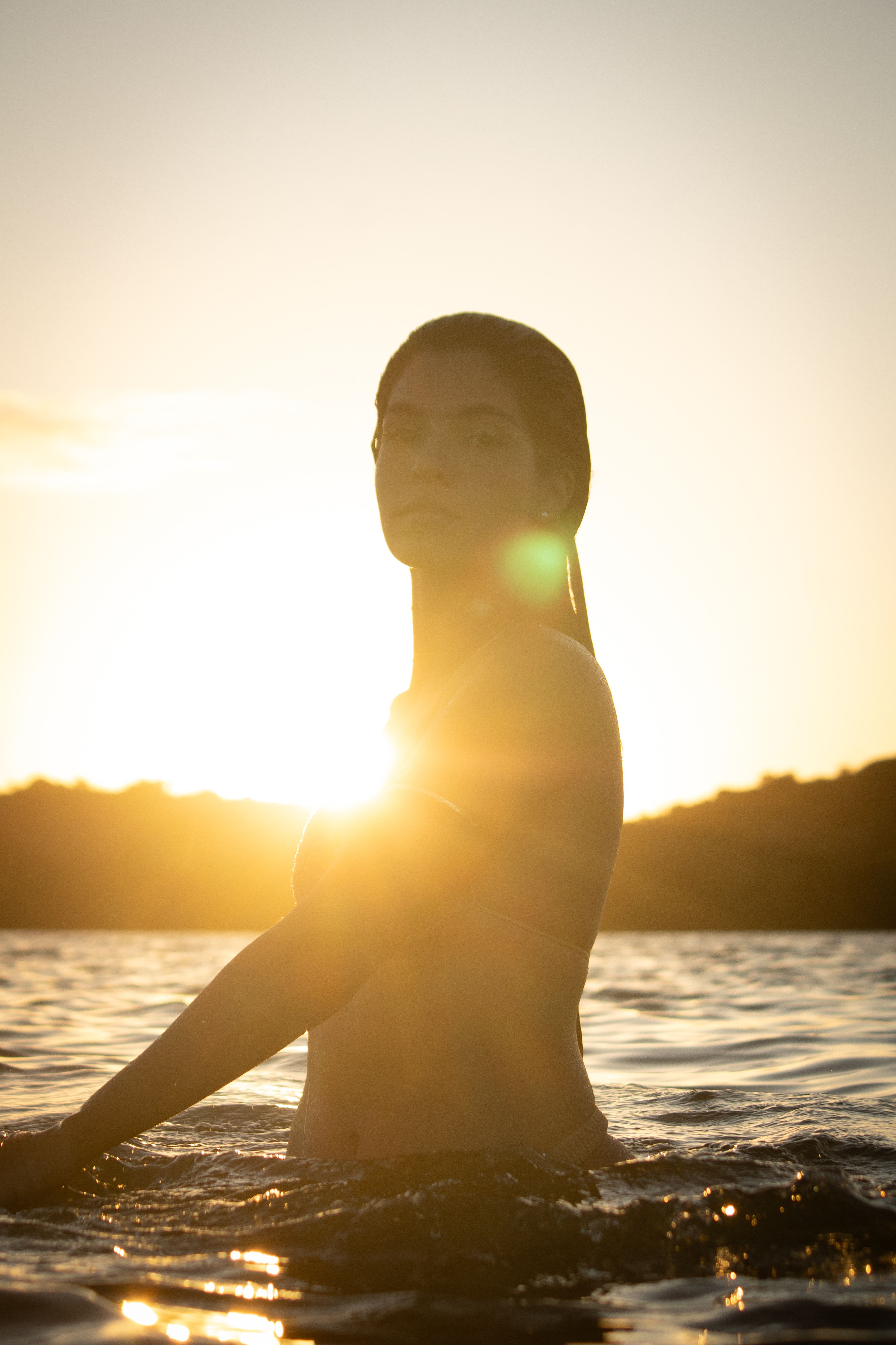 Portrait of Woman in Water at Sunset · Free Stock Photo