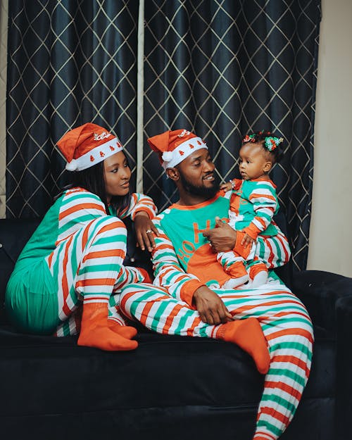 Mother and Father with Baby in Christmas Costumes