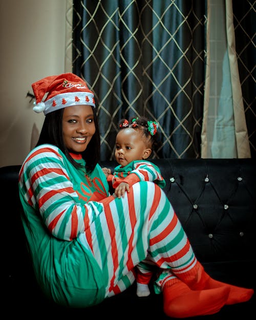 Smiling Woman in Christmas Costume Sitting with Baby