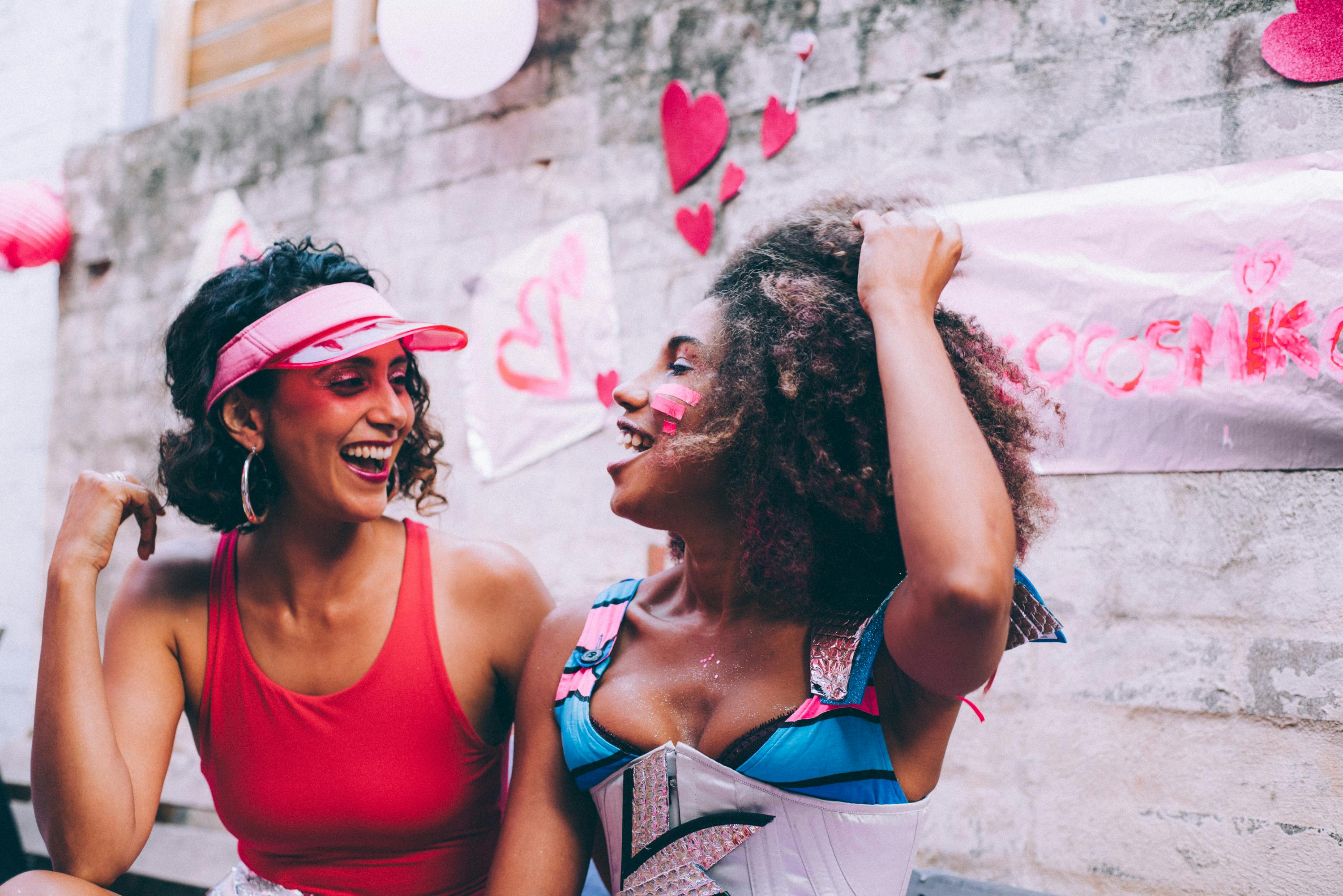 two women laughing at each other