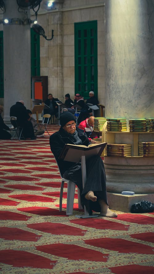 Elderly Man Sitting at Mosque