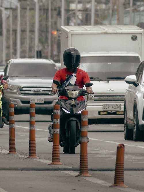 Man on Scooter in City