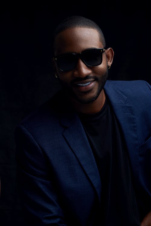 Smiling Man in Sunglasses and Suit