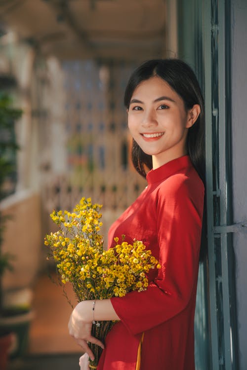 Smiling Woman Holding Flowers