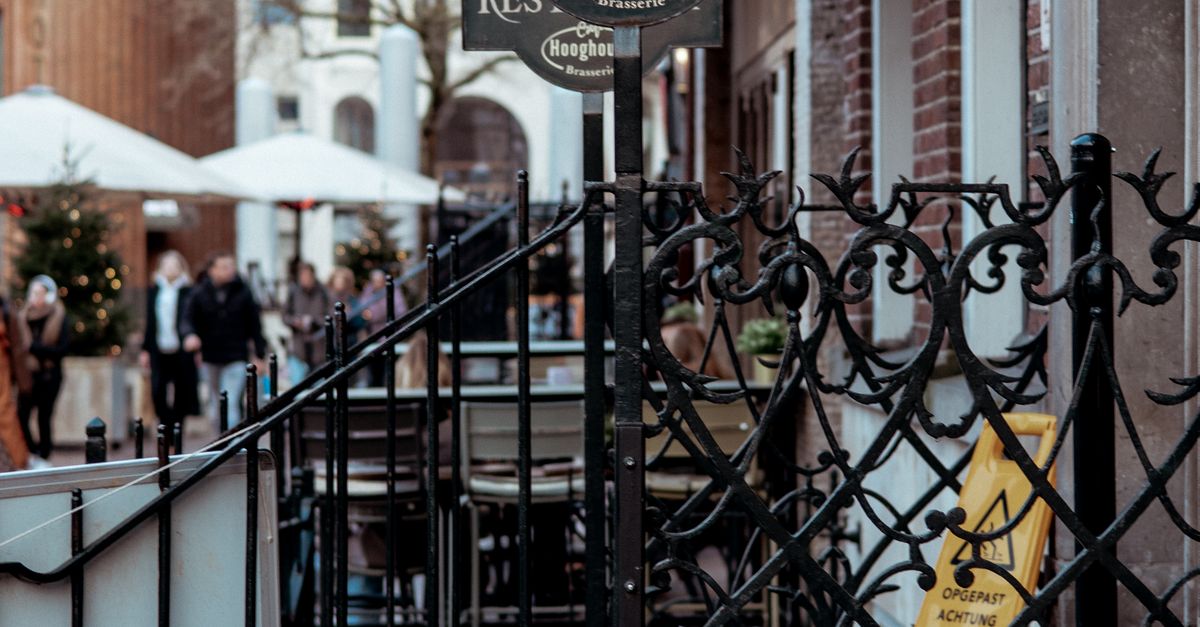 Restaurant Board behind Stairs Railing · Free Stock Photo