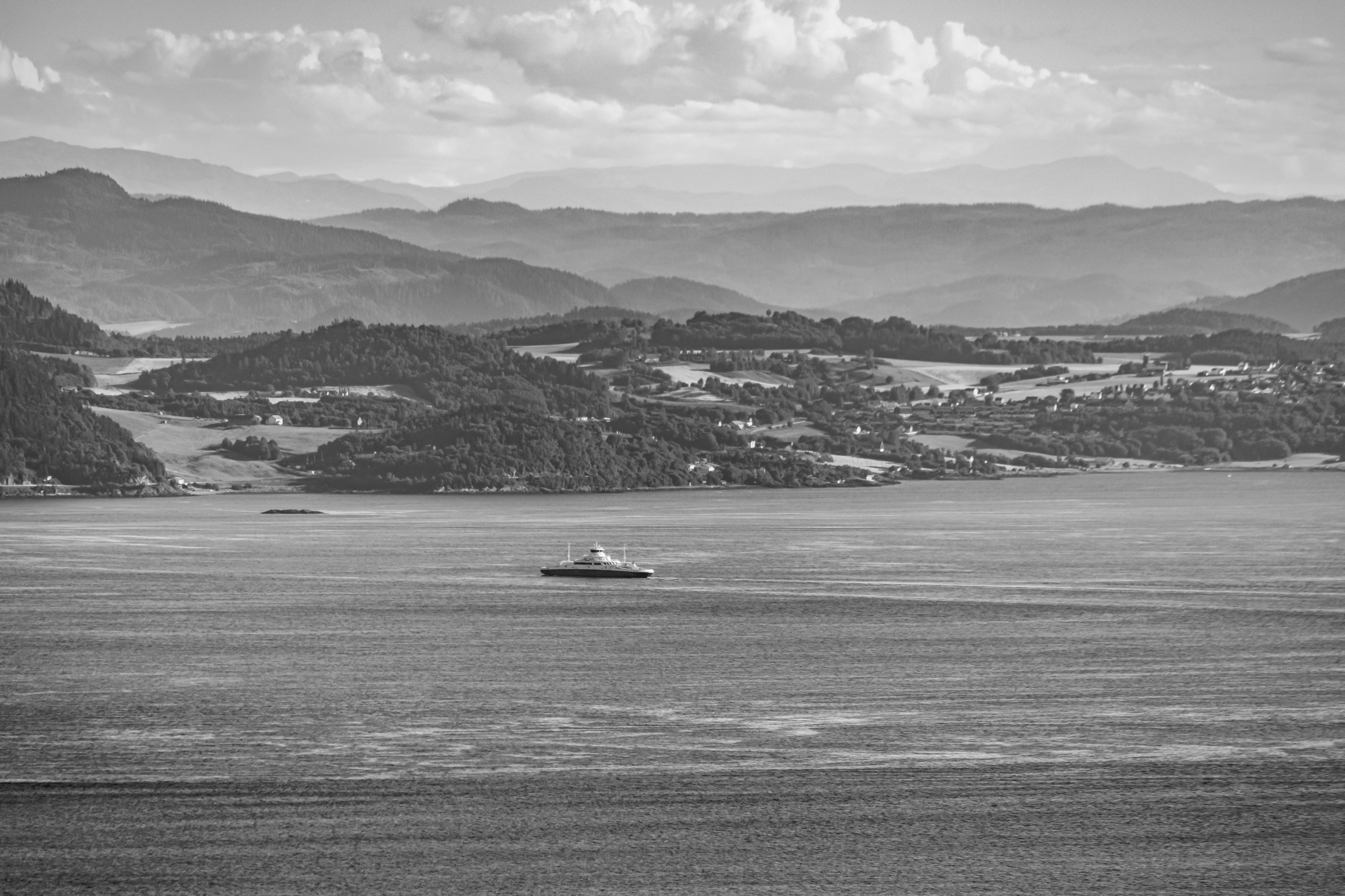 boat on the fjord black and white photo