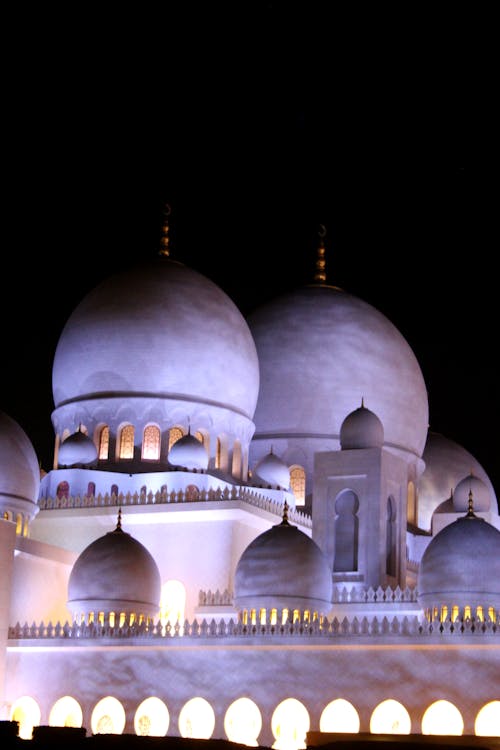 Illuminated Facade of the Sheikh Zayed Grand Mosque in Abu Dhabi, UAE 