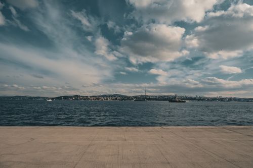 Free A serene view of Istanbul skyline and Bosphorus Strait under a cloudy sky. Stock Photo