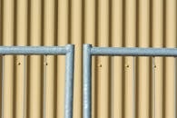 Sheet Metal Wall behind Bars