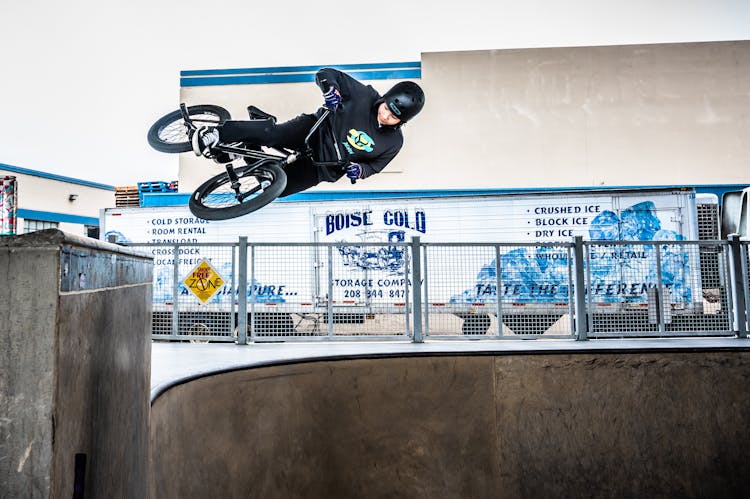 Person Riding Bicycle Doing Stunt On Ramp