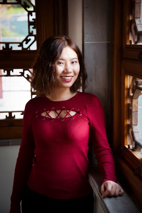 Chinese Teen Tourist at Huntington Garden Moody  Standing Smiling Window Light