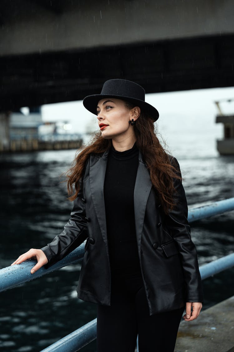 Portrait Of Woman In Leather Jacket And Hat