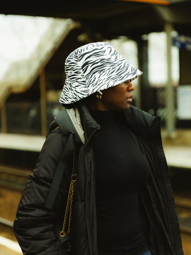 Woman In Hat And Jacket At Railway Station