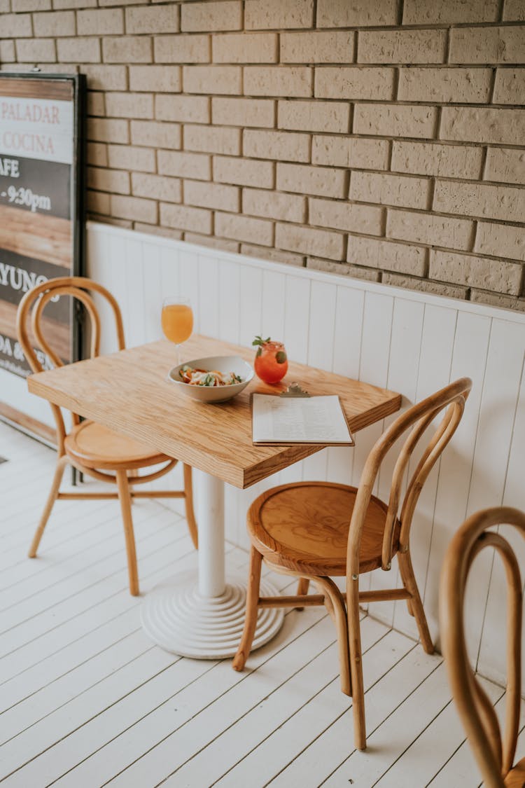 Menu On Wooden Table In Restaurant