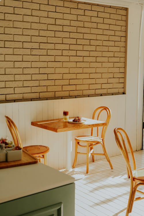 Chairs and Table by Wall in Cafe